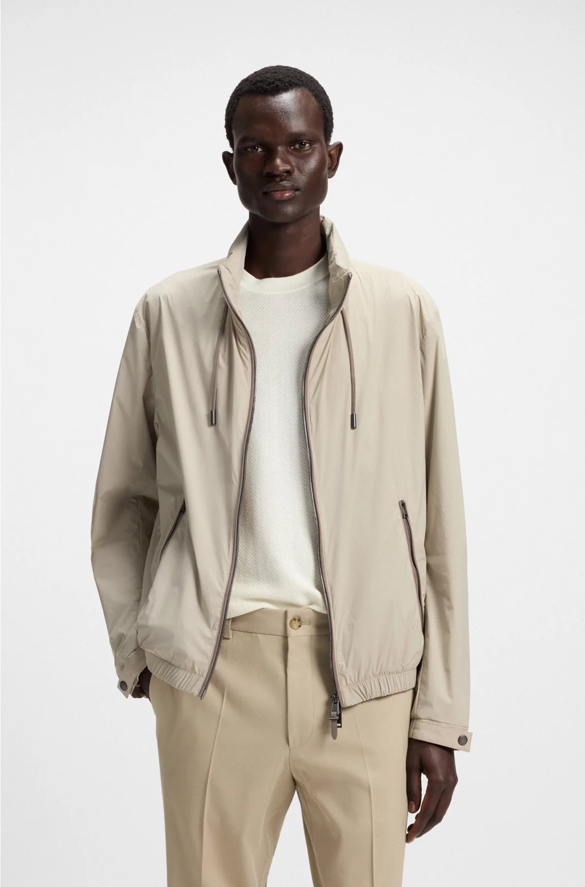 WATER-REPELLENT WINDBREAKER WITH PACKABLE HOOD