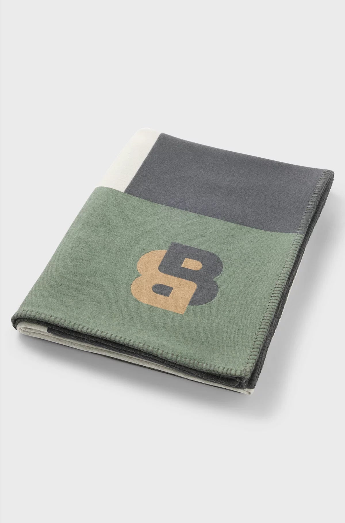 JACQUARD THROW WITH WHIPSTITCHING